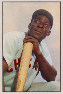 Chicago White Sox outfielder Orestes Minnie Minoso smiles as he poses in  Tampa, Fla., on March 9, 1957. Minoso, whose hometown is Marianao, Cuba,  became the first black player with the White